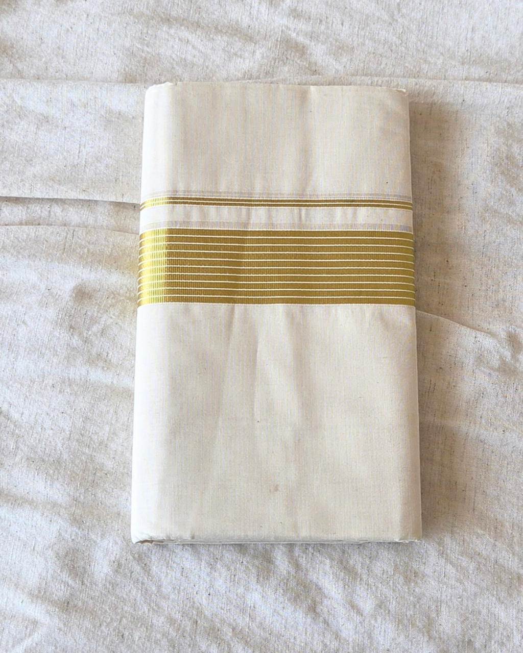 Broad kasavu double mundu angled fold — dense gold zari border, Balaramapuram handloom cotton Canada — Atelier Soza