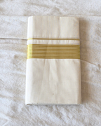 Broad kasavu double mundu angled fold — dense gold zari border, Balaramapuram handloom cotton Canada — Atelier Soza