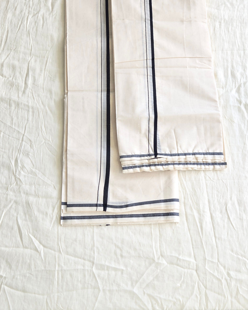 Kerala set mundu folded — classic pulyilakara border, ivory handloom cotton, Canada — Atelier Soza