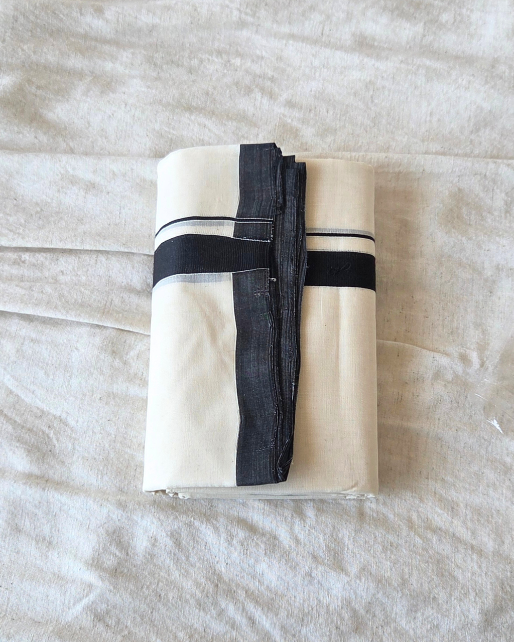 Close-up black stripe border detail — thick and thin kara, Kaithari double mundu handwoven Kerala Canada — Atelier Soza