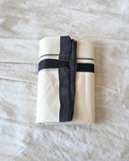 Close-up black stripe border detail — thick and thin kara, Kaithari double mundu handwoven Kerala Canada — Atelier Soza