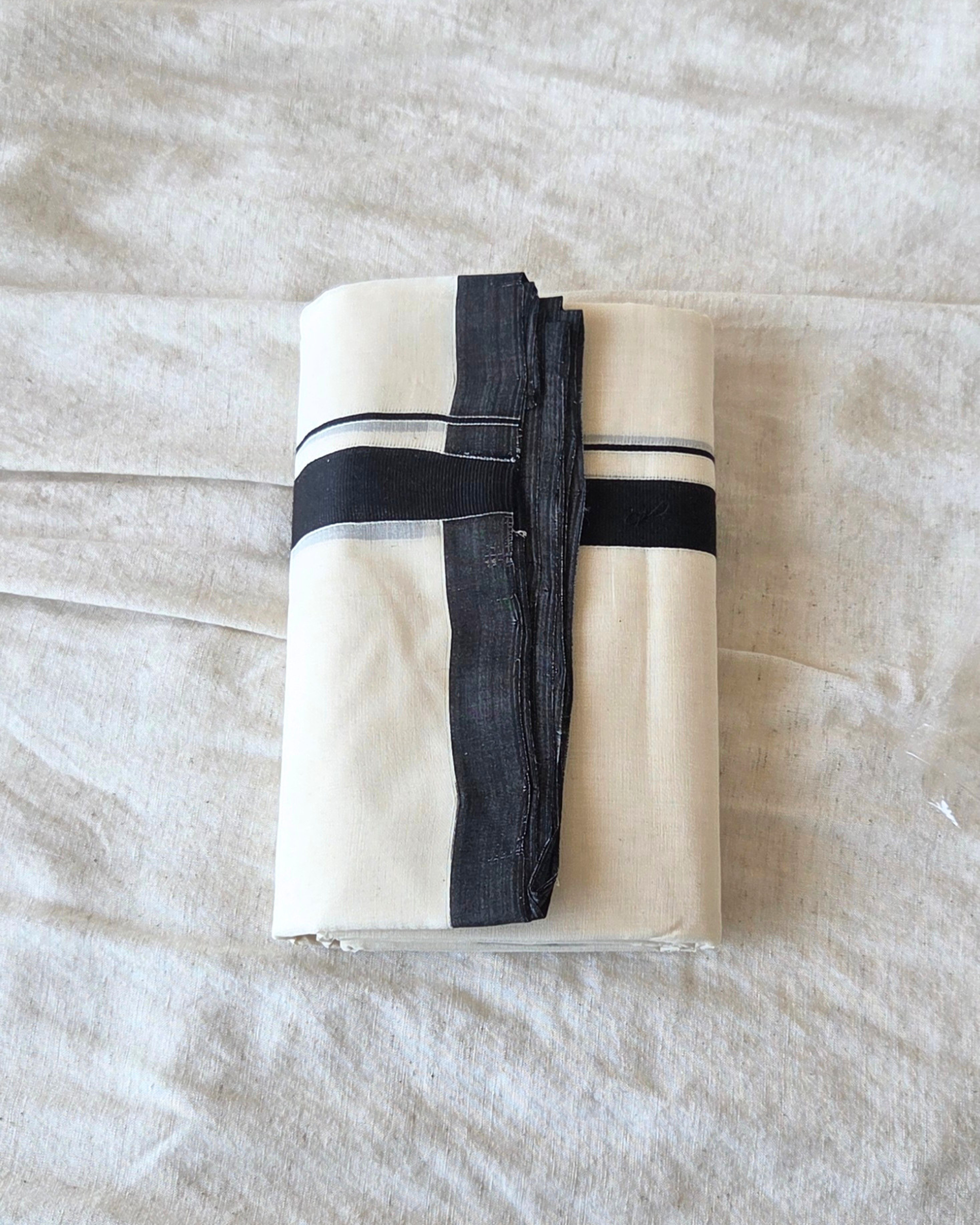 Close-up black stripe border detail — thick and thin kara, Kaithari double mundu handwoven Kerala Canada — Atelier Soza