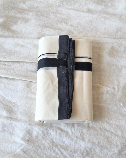 Close-up black stripe border detail — thick and thin kara, Kaithari double mundu handwoven Kerala Canada — Atelier Soza