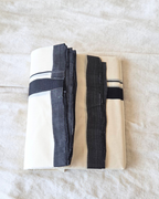 Close-up black stripe border detail — thick and thin kara, Kaithari double mundu handwoven Kerala Canada — Atelier Soza